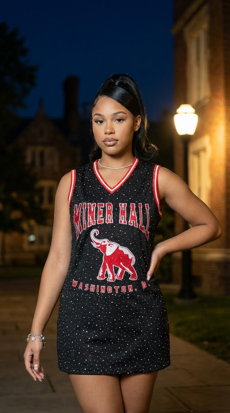 Woman wearing a black and red 'Miner Hall' dress with an elephant graphic at night.